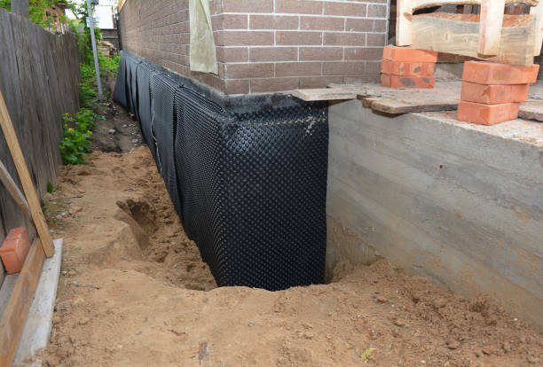SJ Waterproofing Pros technician performing targeted Waterproofing assessment in Jeffersonville, IN
